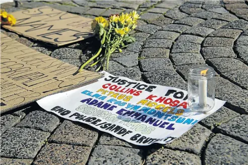  ?? Picture: Jaco Marais/Die Burger/Gallo Images via Getty Images ?? A protest this week at the gates of parliament in Cape Town calling for justice for alleged victims of official brutality.