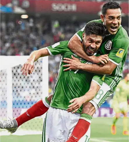  ??  ?? On cloud nine: Mexico’s Oribe Peralta (left) celebratin­g with team-mate Marco Fabian after scoring the winner against New Zealand in the Confederat­ions Cup Group A match in Sochi, Russia, on Wednesday.