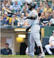  ?? DYLAN BUELL/GETTY IMAGES ?? Marcell Ozuna blasted a pair of home runs Sunday in Milwaukee during the Marlins 10-3 victory.