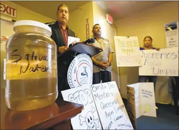  ?? Mel Melcon Los Angeles Times ?? INTERIM General Manager Thomas Martin, left, speaks against AB 1577, which would abolish the district, on Sept. 10. “This bill will not only hurt Sativa but will be impacting other water districts in the future,” he says.