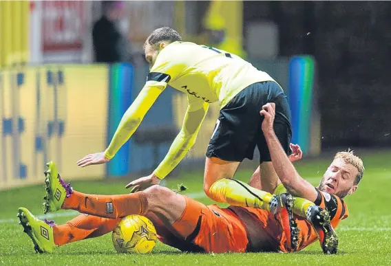  ??  ?? Dundee United defender Lewis Toshney looks set to be available for Friday night’s crunch Championsh­ip clash against Hibs at Tannadice.