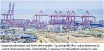  ??  ?? Equipment and materials sit at the site of Colombo Port City, developed by China Harbour Engineerin­g Co., a unit of China Communicat­ions Constructi­on Co., foreground, at Port of Colombo in Colombo, Sri Lanka (Bloomberg/atul Loke).