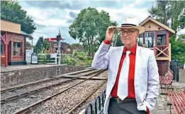  ?? ?? The manager now arriving: Robin Coombes soaks up the atmosphere at the Kent & East Sussex Railway station of Tenterden Town, having been appointed general manager in succession to Shaun Dewey. RHIAIN DAVIES