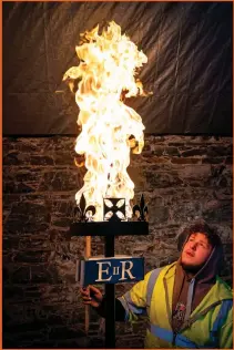  ?? ?? Left, Lewis Wilde tests one of the gas beacons he has made for the Queen’s Platinum Jubilee in June, at his workshop in Selkirk