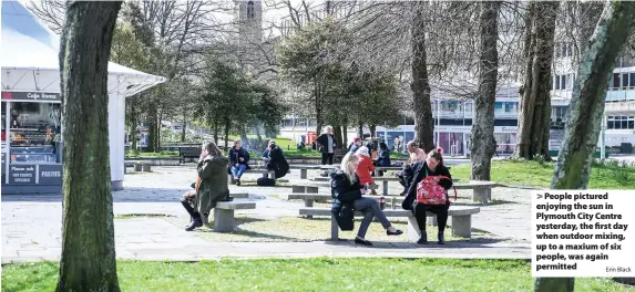  ?? Erin Black ?? > People pictured enjoying the sun in Plymouth City Centre yesterday, the first day when outdoor mixing, up to a maxium of six people, was again permitted
