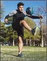  ?? (AP/The Deseret News/Scott G Winterton) ?? Mohammad Tamim Solhadost, a recent refugee from Afghanista­n, goes through a short workout Nov. 17 at Liberty Park in Salt Lake City. He hopes to pursue a profession­al soccer career.