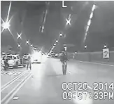  ?? AP ?? This scene from dashcam video taken Oct. 20, 2014 shows Laquan McDonald walking down the street moments before being shot by officer Jason Van Dyke in Chicago.