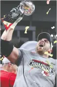  ?? TOM PENNINGTON / GETTY IMAGES ?? Laurent Duvernay-tardif raises the Vince Lombardi
Trophy in February.