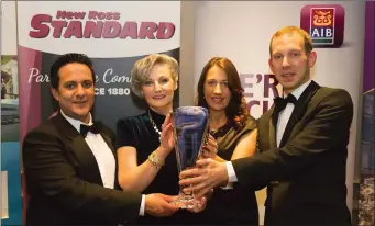  ??  ?? Anna Furlong (centre left) winner receives the Person of the Year award from Niall Bennett (left), President New Ross and District Chamber of Commerce, Anita Furlong and David Looby, People Newspapers, sponsor at the New Ross and District Chamber of...