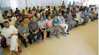  ??  ?? Applicants wait for their turn at the Sharjah immigratio­n centre.