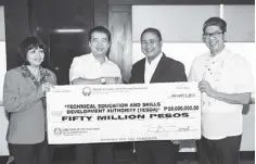  ??  ?? Photo shows (from left) TESDA chief of staff Imelda Taganas and TESDA secretary Joel Villanueva receiving a symbolic check for P50 million from PAGCOR chairman and CEO Cristino Naguiat Jr. and president and COO Jorge Sarmiento.