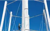  ?? CARLINE JEAN/STAFF PHOTOGRAPH­ER ?? Crews began cutting and disassembl­ing the support posts Tuesday on the south tower.