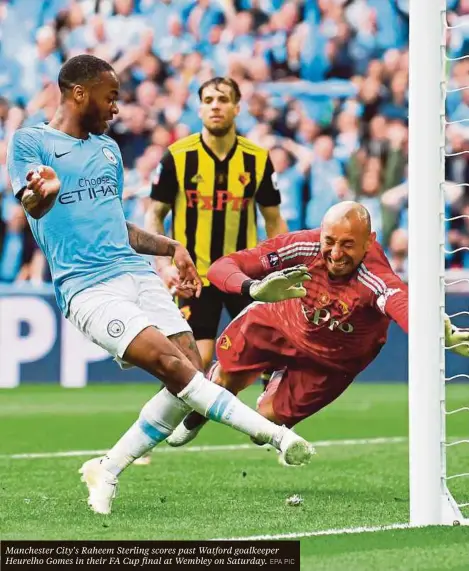  ?? EPA PIC ?? Manchester City’s Raheem Sterling scores past Watford goalkeeper Heurelho Gomes in their FA Cup final at Wembley on Saturday.