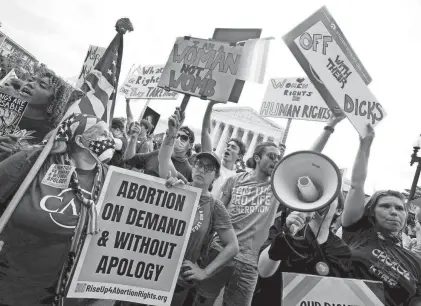  ?? STEVE HELBER/AP ?? People protest about abortion on Friday outside the Supreme Court in Washington. The Supreme Court has ended constituti­onal protection­s for abortion that had been in place for nearly 50 years.