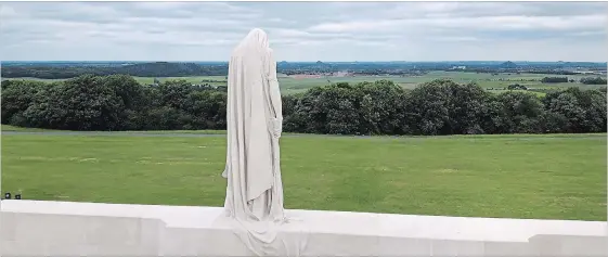  ?? LYNN HADDRALL ?? The mourning figure known as Canada Bereft dominates the landscape at Vimy Ridge on the highest point of the battlefiel­d where 3,598 Canadians died for victory in 1917.