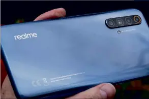  ??  ?? ABOVE The shiny 5G Realme handset was a nice, albeit rather befuddling, surprise