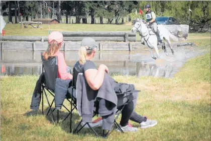  ?? PHOTO/WARREN BUCKLAND ?? A rider enters a water jump under close scrutiny during class 2 of the Arran Station spring horse trial in Takapau on Sunday.
