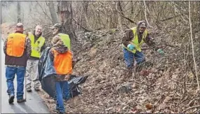  ?? SUBMITTED PHOTO ?? Volunteers clad in gloves and bright vests clean junk from the roadside during last year’s Red Clay Cleanup.