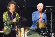  ?? Chris Pizzello / Associated Press ?? Rolling Stones drummer Charlie Watts, right, performs behind singer Mick Jagger during their concert at the Rose Bowl on Aug. 22, 2019, in Pasadena, Calif. Watts has died in London at age 80.