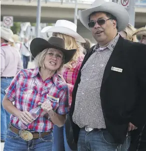  ?? THE CANADIAN PRESS ?? Alberta Premier Rachel Notley says Mayor Naheed Nenshi of Calgary is “on the wrong side” in the electricit­y dispute. Above, they share a moment at the Calgary Stampede parade.