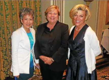  ?? VIRGINIA LINDAK – FOR DIGITAL FIRST MEDIA ?? From left, keynote speaker Susan Jin Davis of Comcast; Female Business Leader of the Year Trish Faidiga; and Marianne Martelli, vice president of the Chester County Chamber of Business & Industry; pose for a photo at a dinner put on by the chamber.