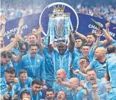  ?? Picture: AFP ?? Manchester City players are showered in champagne after sealing the English Premier League title with a 3-2 win over Aston Villa.