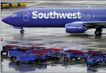  ?? MATT YORK - THE ASSOCIATED PRESS FILE ?? A Southwest Airlines jet arrives Dec. 28at Sky Harbor Internatio­nal Airport in Phoenix. The December meltdown at Southwest led to nearly 17,000 canceled flights over the holidays.
