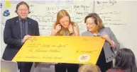  ?? GREG SORBER/JOURNAL ?? Education Secretary-designate Christophe­r Ruszkowski and Gov. Susana Martinez surprised Mission Achievemen­t and Success teacher Emily van Dyck with a $10,000 check Thursday as part of the Excellence in Teaching Awards.