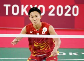  ?? — AFP file photo ?? Momota hits a shot to South Korea’s Heo Kwang-hee in their men’s singles badminton group stage match during the Tokyo Olympic Games at the Musashino Forest Sports Plaza in Tokyo.