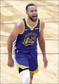  ??  ?? Stephen Curry of the Golden State Warriors reacts after scoring a three point basket during the third quarter of an NBA game against the New Orleans Pelicans at Smoothie King Center in New Orleans, Louisiana, on Tuesday.