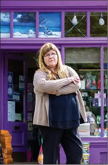  ??  ?? Seeing red: Martha Gibson outside her lilac shop front