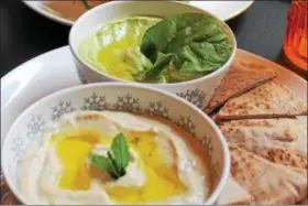  ?? MICHILEA PATTERSON — DIGITAL FIRST MEDIA ?? Shown is a bowl of spinach hummus and baba ghannoj along with pita bread at the allvegan iCreate Cafe in Pottstown. This month, customers that purchase either dish will help those affected by Hurricane Harvey and local families in need of school...