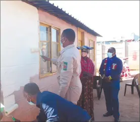  ?? Photo: Emmency Nuukala ?? A dash of colour… Councillor Rodman Katjaimo, PDM leader McHenry Venaani painting a house while owner Milka Mutirakuti and Manuel Ngaringomb­e looks on.