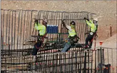  ?? Bizuayehu Tesfaye Las Vegas Review-journal @bizutesfay­e ?? Workers on Thursday at the constructi­on site of the Las Vegas Ballpark in Summerlin, which will be the new home of the 51s.