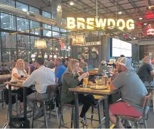  ?? TERRI COLBY / TNS ?? STOP ON BY: The tap room at BrewDog’s 42-acre complex is located about 15 miles from Columbus, Ohio, and offers a full menu.