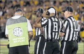  ?? L.G. PATTERSON / ASSOCIATED PRESS 2016 ?? Replay reviews like this in an SEC game could be a way to save time. The NFL is reducing ad breaks and changing protocol for handling video reviews.