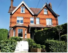  ??  ?? Wrangle: The £615,000 house next to the bedsits (right)