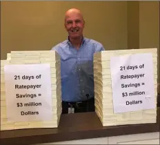  ?? MEDIANEWS GROUP FILE PHOTO ?? In this photo from last September, Chester Water Authority board member Joe McGinn stands in front of stacks of money, which the company says represents the savings for rate payers as they attempt to fend off a ‘hostile takeover’ from Aqua.