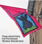  ??  ?? Flags advertisin­g the Portishead Window Wanderland