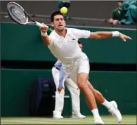  ?? AP/NIC BOTHMA ?? Novak Djokovic returns a ball to Rafael Nadal during Saturday’s Wimbledon men’s singles semifinal match in London. Djokovic won 6-4, 3-6, 7-6 (9), 3-6, 10-8 to advance to today’s final against Kevin Anderson.