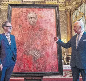  ?? AARON CHOWN THE ASSOCIATED PRESS ?? It’s unclear whether King Charles loves his new portrait by Jonathan Yeo, left, or is scared of it, writes Vinay Menon. who hasn’t seen this much red since Melania Trump’s White House Christmas display.