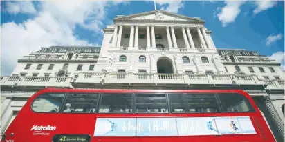  ?? (Neil Hall/Reuters) ?? A BUS passes the Bank of England in London last week. Britain is yet to begin formal talks with the EU about its future relationsh­ip. But retaining access to the single market, particular­ly for financial services, will be a key part of the negotiatio­ns.