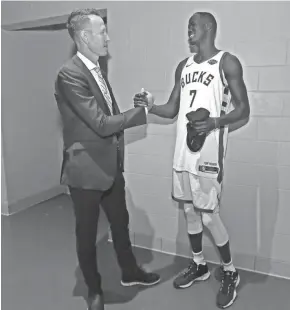  ??  ?? Thon Maker, who was out with knee soreness in the preseason, talks with TV analyst Steve Novak.