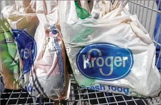  ?? ROGELIO V. SOLIS / ASSOCIATED PRESS 2017 ?? Kroger plans to phase out single-use plastic bags by 2025. Its QFC brand of stores in the Pacific Northwest will be the first to lose the bags, followed by all other lines in the family of stores.