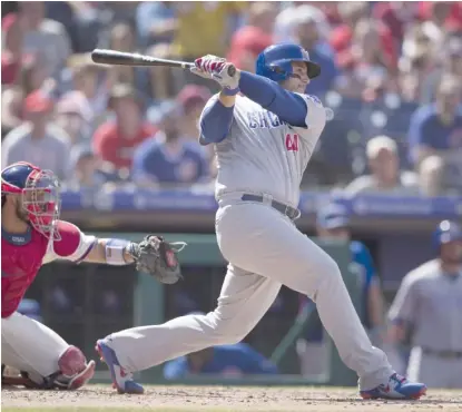  ?? MITCHELL LEFF/GETTY IMAGES ?? Anthony Rizzo launches one of the Cubs’ three home runs Sunday against the Phillies.