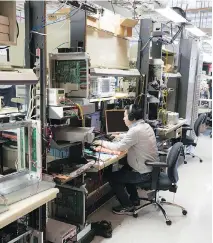  ??  ?? A technician works in the hardware lab inside the new high-tech campus at Ciena, which occupies three main buildings.