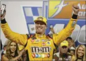  ?? STEVE HELLER - THE ASSOCIATED PRESS ?? Kyle Busch celebrates winning the NASCAR Cup Series auto race in victory lane at Richmond Raceway in Richmond, Va., Saturday.