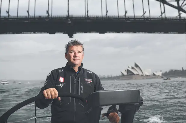  ?? Picture: Brett Costello ?? AT THE HELM: Skipper David Witt steers Hong Kong entry Scallywag during a training run.