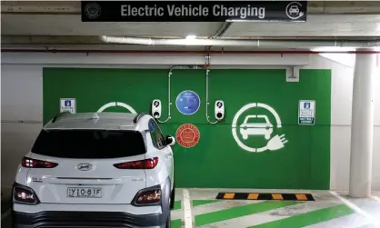  ?? Photograph: Brendon Thorne/Getty Images ?? A car charges at an electric vehicle charge station in Crows Nest, Sydney. The Victorian Labor government wants to impose a tax on electric cars and other zero-emissions vehicles.