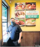  ?? JOE BURBANK/ORLANDO SENTINEL ?? Managing Partner David Barrett at the Metro Diner Express’ new takeout window Wednesday at their UCF location on University Boulevard.